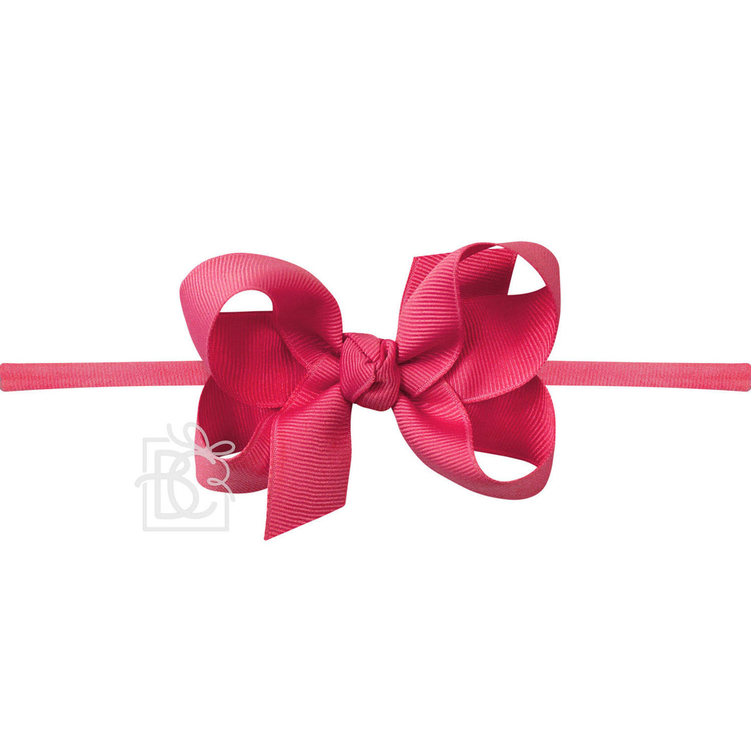 Pink hair bow on a white background