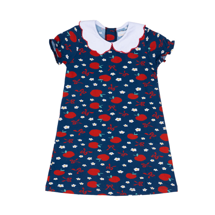 Children's dress with red apple pattern on a blue background