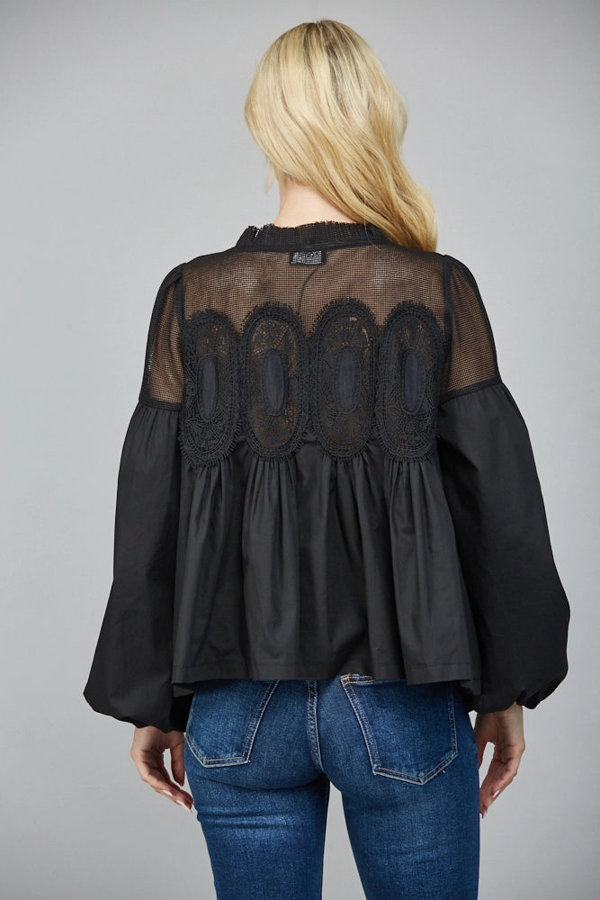 blonde woman wearing Lace applique detail mixed media long slv blouse on white background