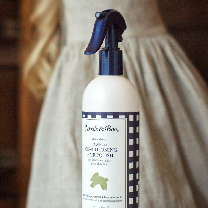Bottle of Noodle & Boo Leave-In Conditioning Hair Polish on a neutral background