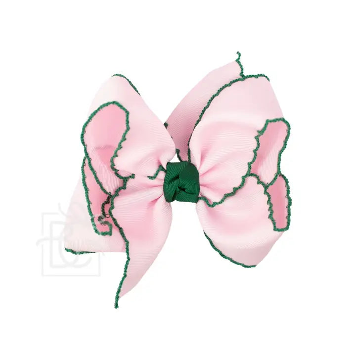 Pink bow with green trim on a white background