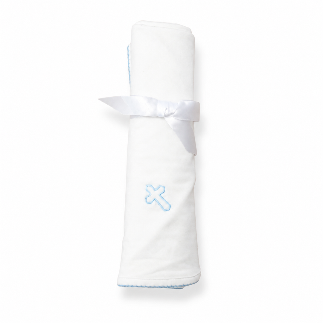 White blanket with a blue 'cross' design on a white background