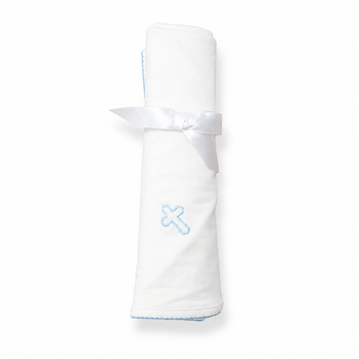 White blanket with a blue 'cross' design on a white background