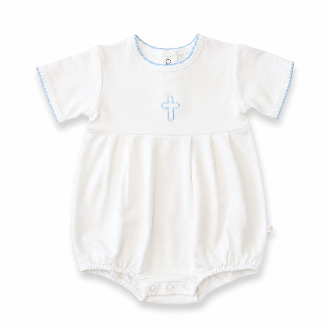 White baby romper with blue cross design on a white background