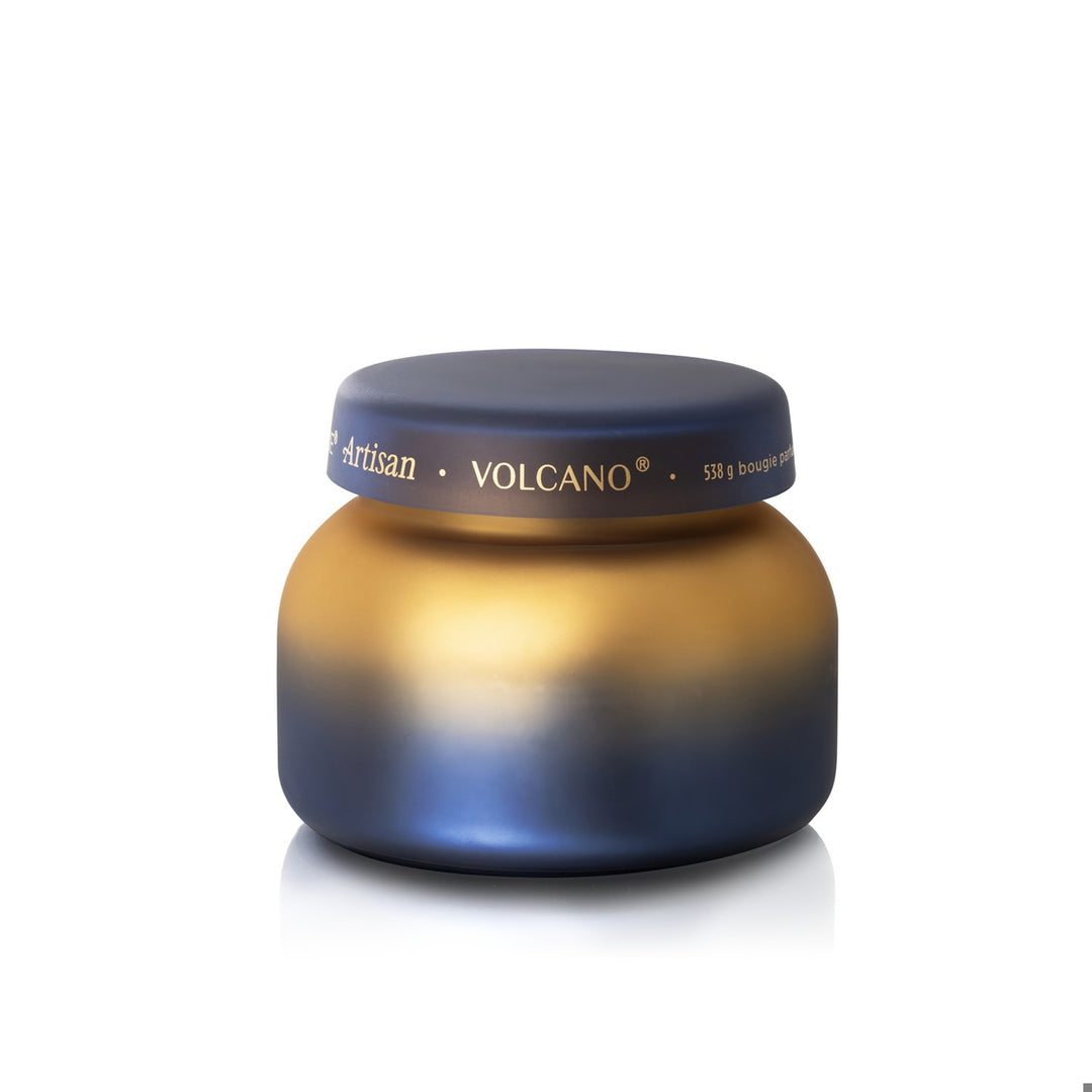 Volcano Tuscan Radiance signature candle in a gold and deep blue ombre glass jar