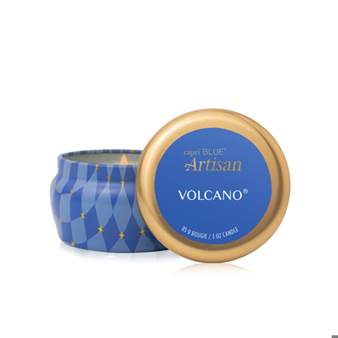 Volcano Winter Bazaar mini tin candle with blue geometric pattern and gold stars