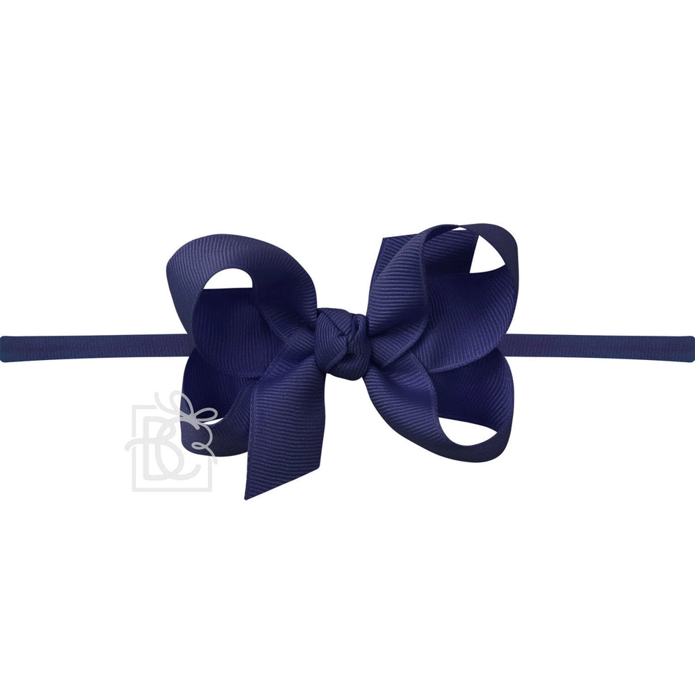 A navy blue pantyhose headband with a large bow.