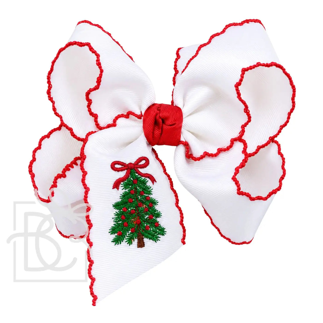 white bow with red crochet edge and christmas tree embroidered on tail of bow