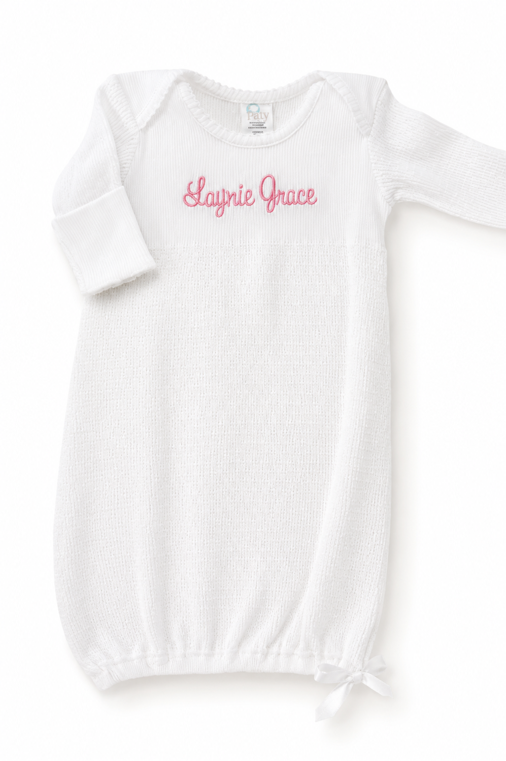 A white long-sleeve baby bodysuit with 'Laynie Grace' embroidered in pink script across the chest, displayed flat against a white background.
