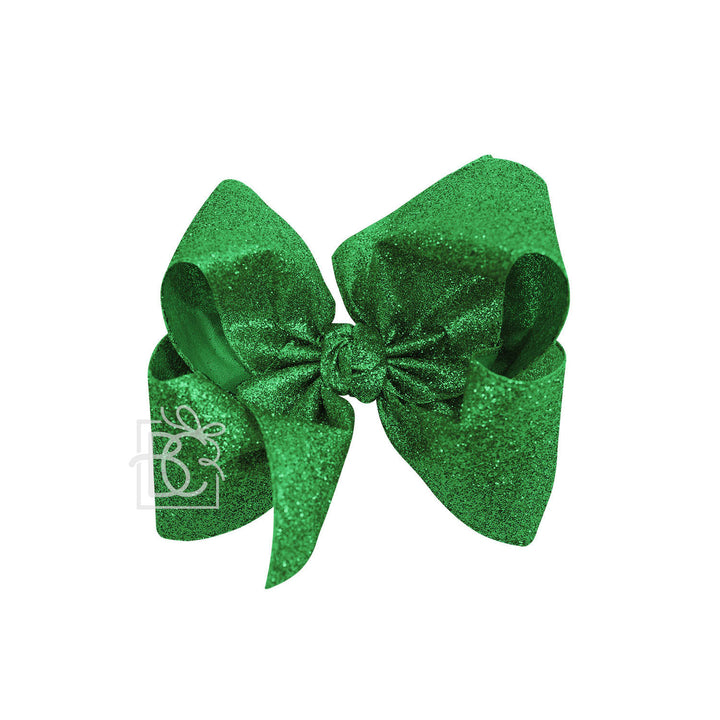 Green glittery bow  on a white background