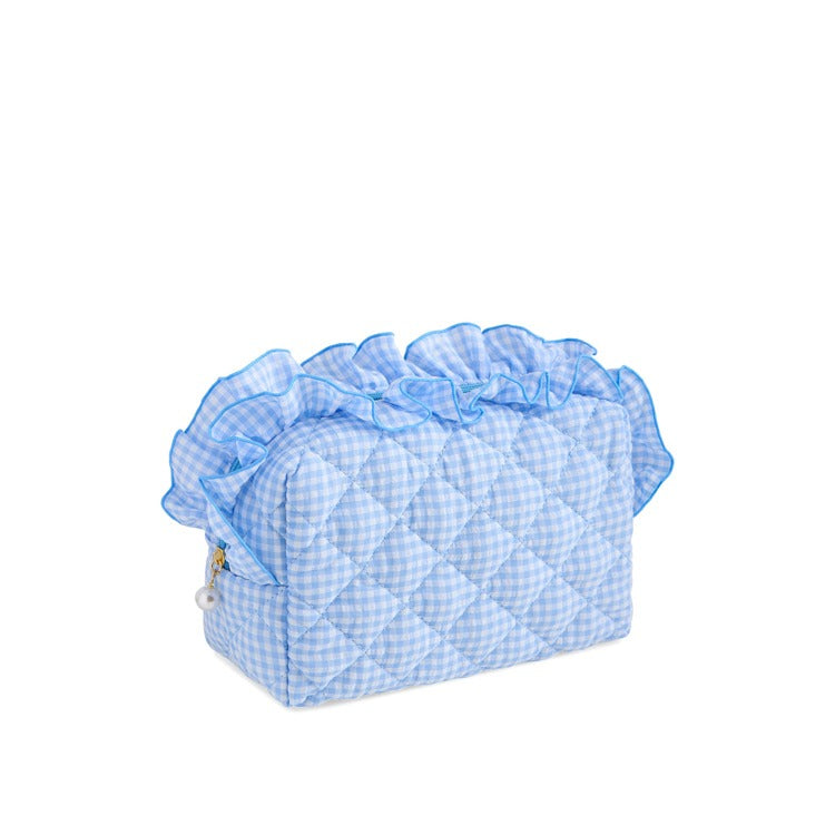 Light blue gingham quilted cosmetic pouch with ruffle trim and zip closure | Walker Boutique