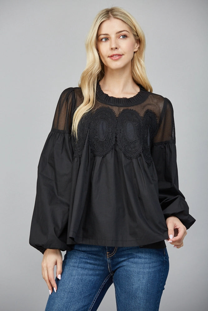 blonde woman wearing Lace applique detail mixed media long slv blouse on white background