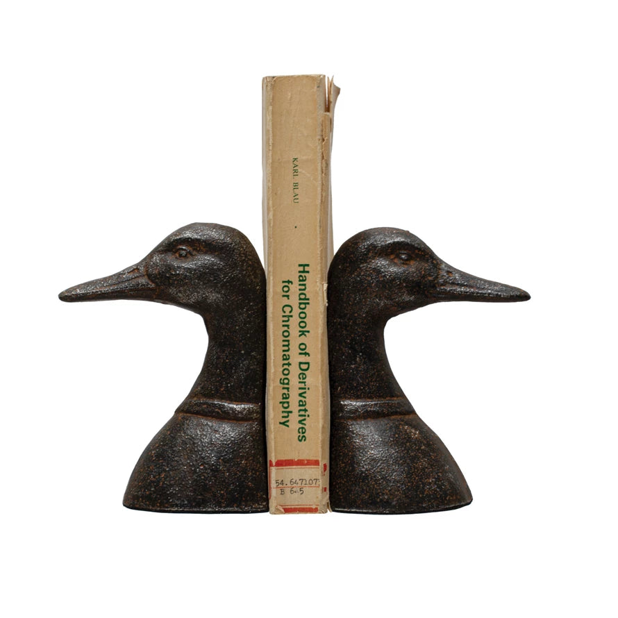 duck bookends with book between