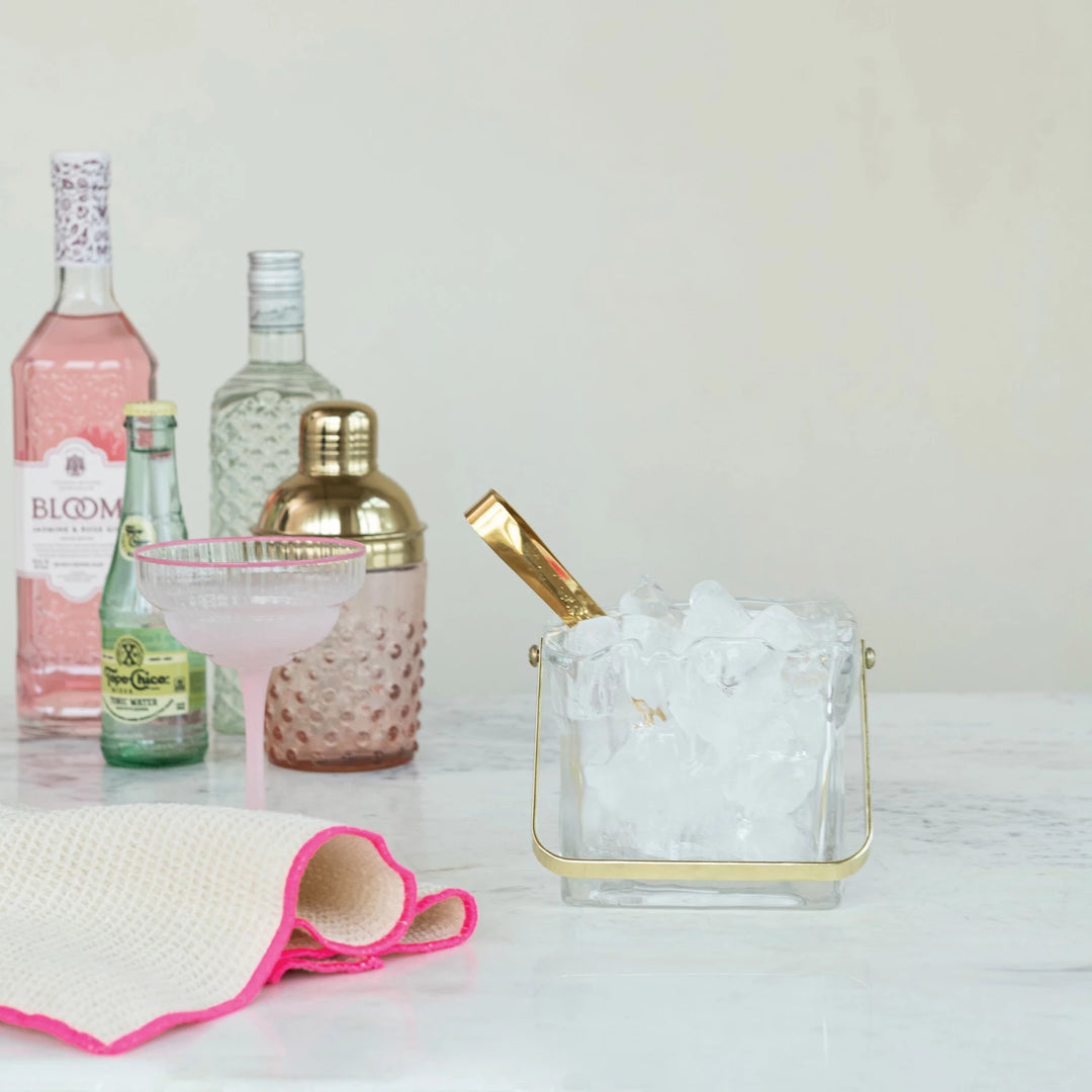 styled glass ice bucket with tongs