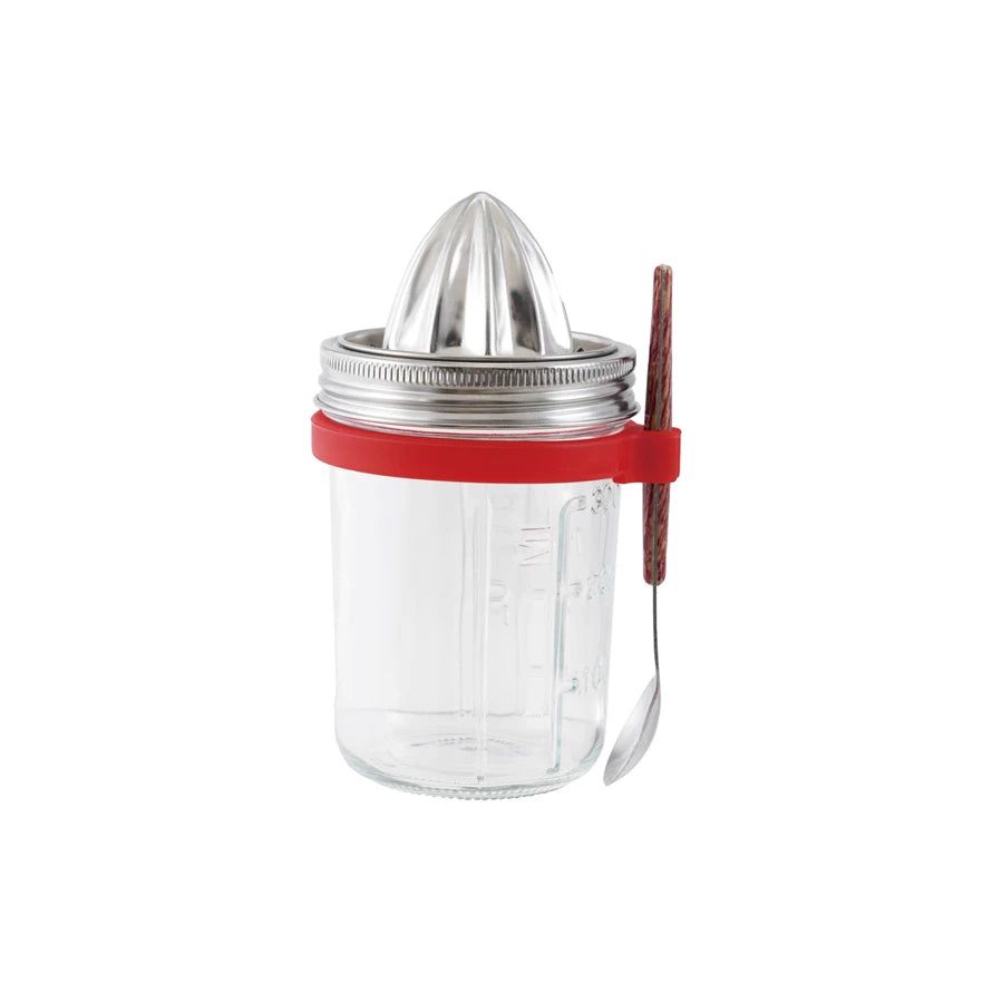 Clear glass jar with metal citrus press and red handle on a white background