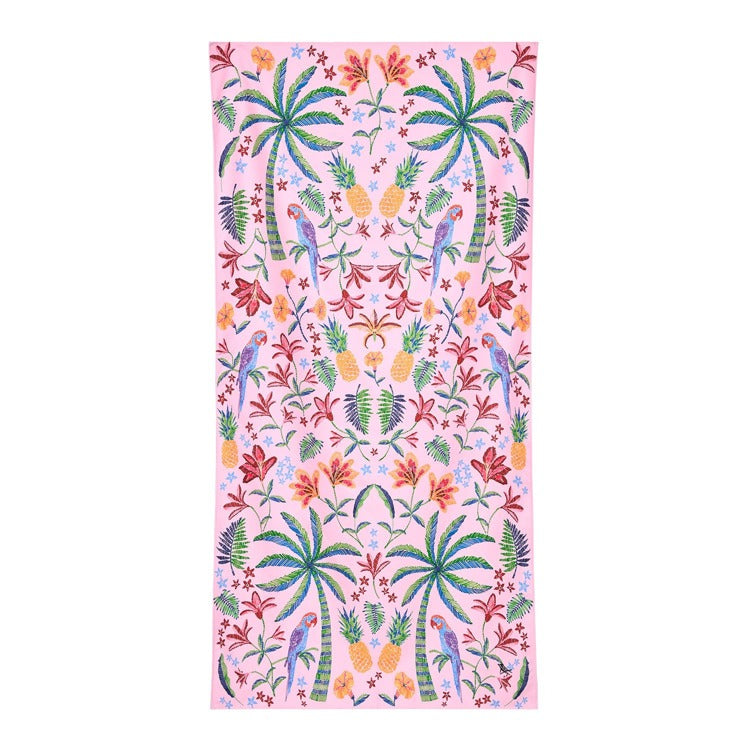 Tropical patterned towel with palm trees, flowers, and parrots on a pink background