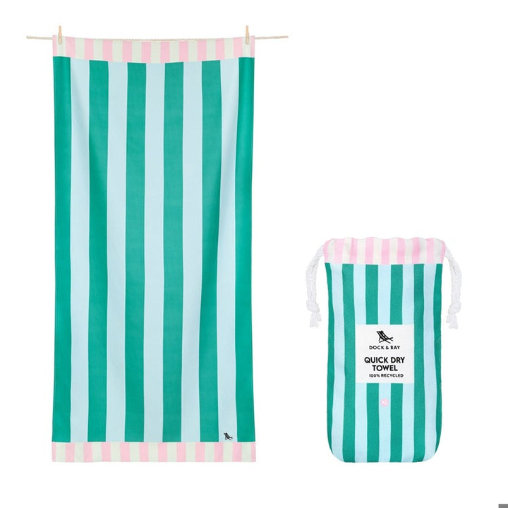 Green and light blue striped towel with matching drawstring bag on a white background