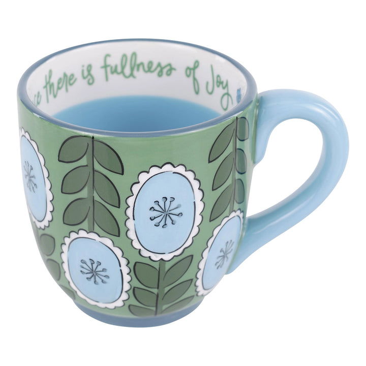 GREEN COFFEE MUF WITH BLUE FLORAL DETAIL AND BIBLE VERSE PAINTED ON RIM