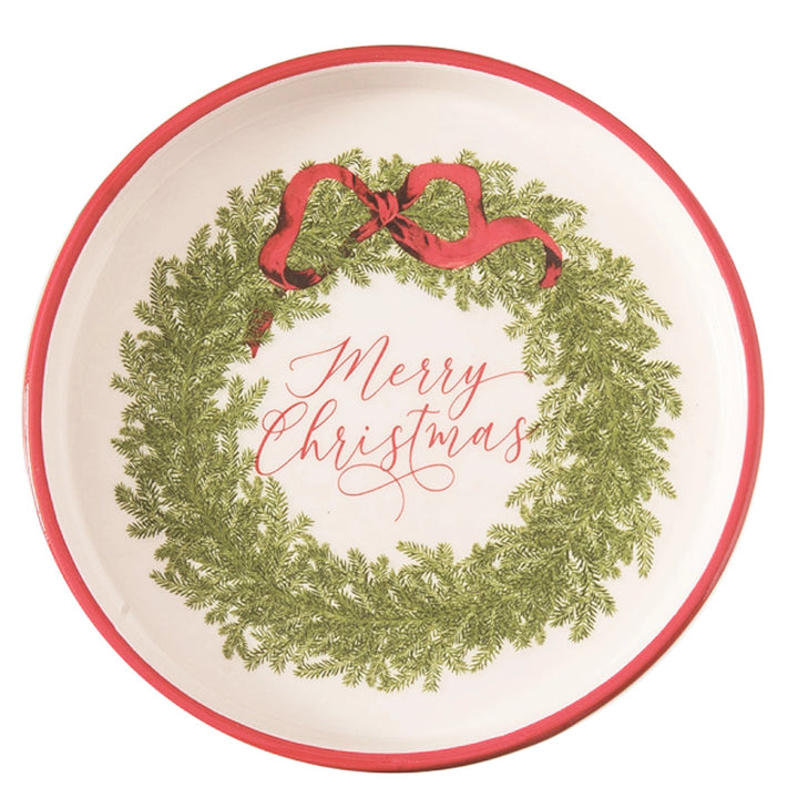 Round plate with Christmas wreath and 'Merry Christmas' text on a white background