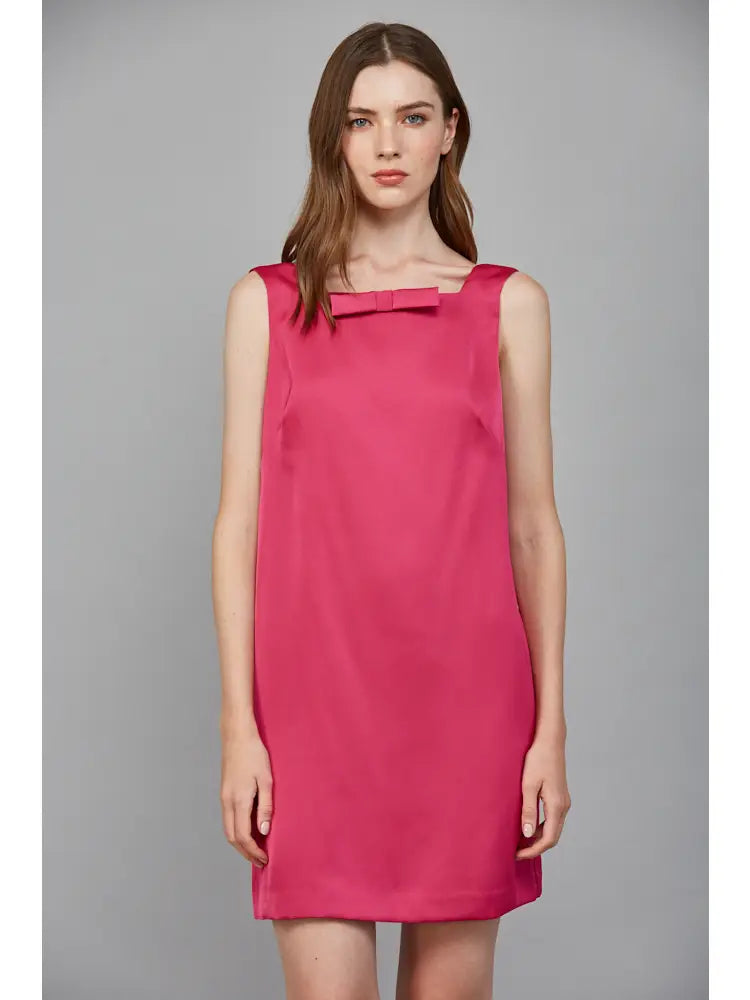 The square neckline and charming bow detail add a touch of elegance, making it perfect for both casual outings and special events.
