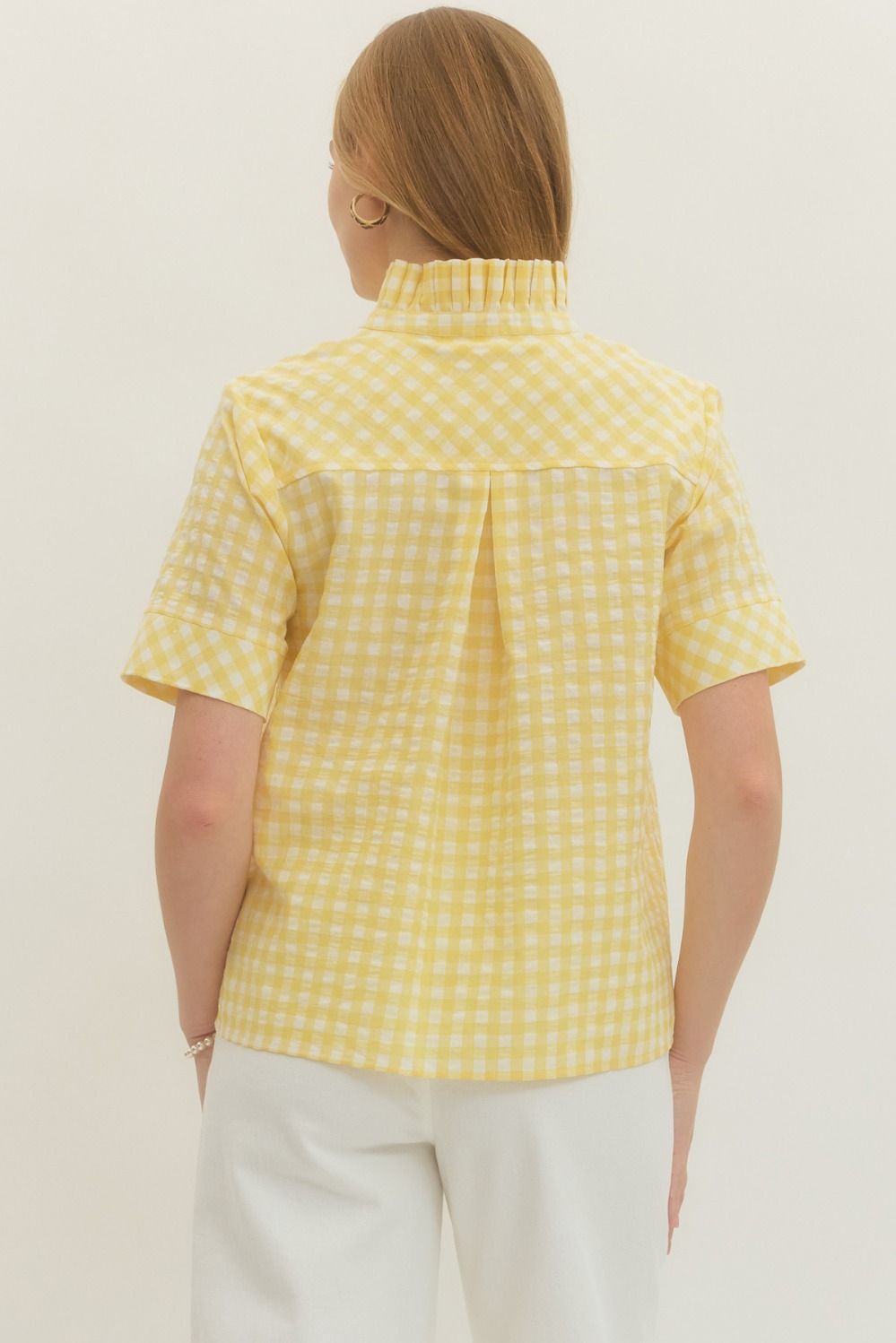 REAR VIEW OF SHEER YELLOW GINGHAM SHORTSLEEVE BLOUSE ON WHITE BACKGROUND