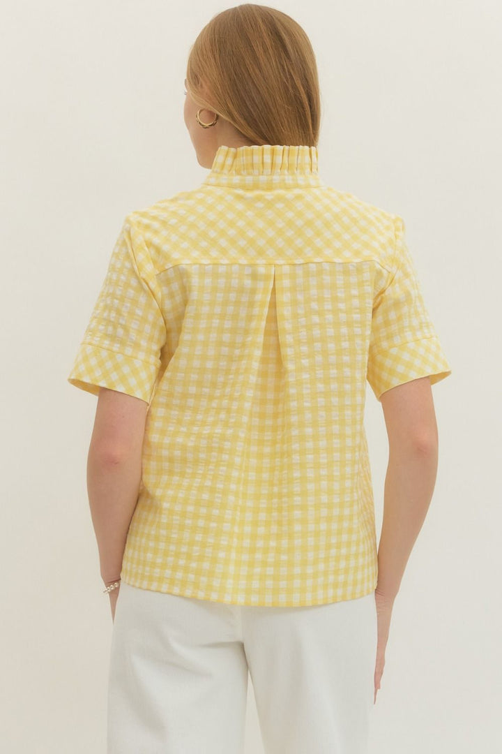 REAR VIEW OF SHEER YELLOW GINGHAM SHORTSLEEVE BLOUSE ON WHITE BACKGROUND