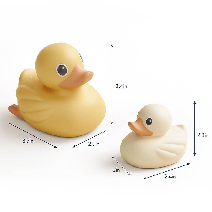Two rubber ducks with measurements indicated on a white background