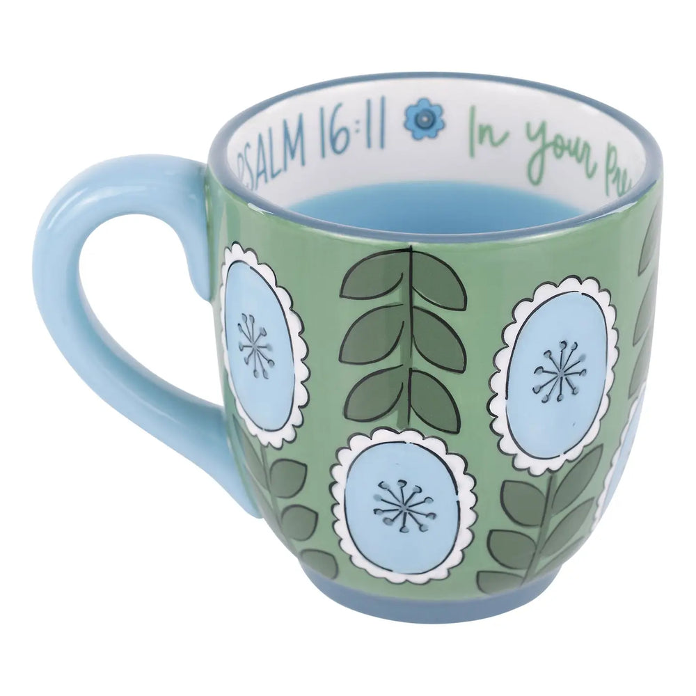 GREEN COFFEE MUF WITH BLUE FLORAL DETAIL AND BIBLE VERSE PAINTED ON RIM