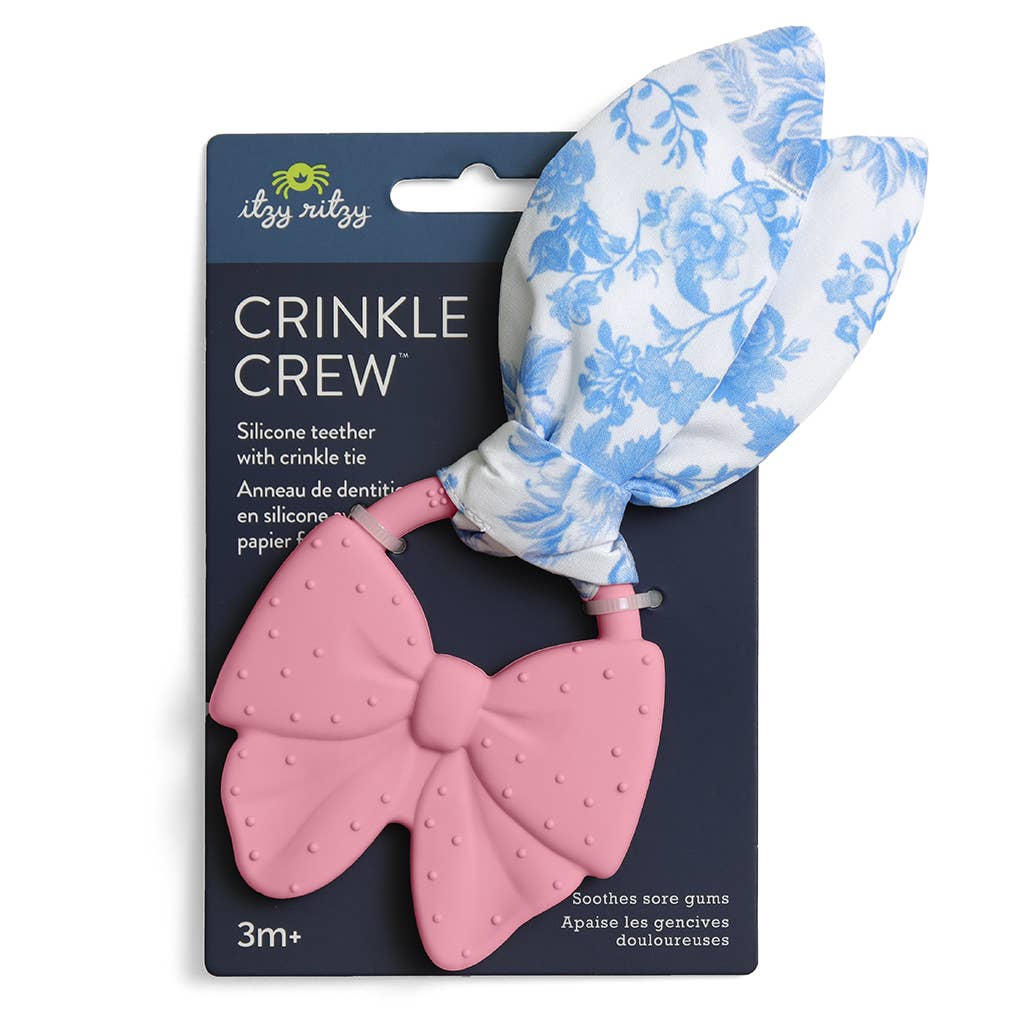 Pink silicone teether with crinkle tie on illy ruby packaging