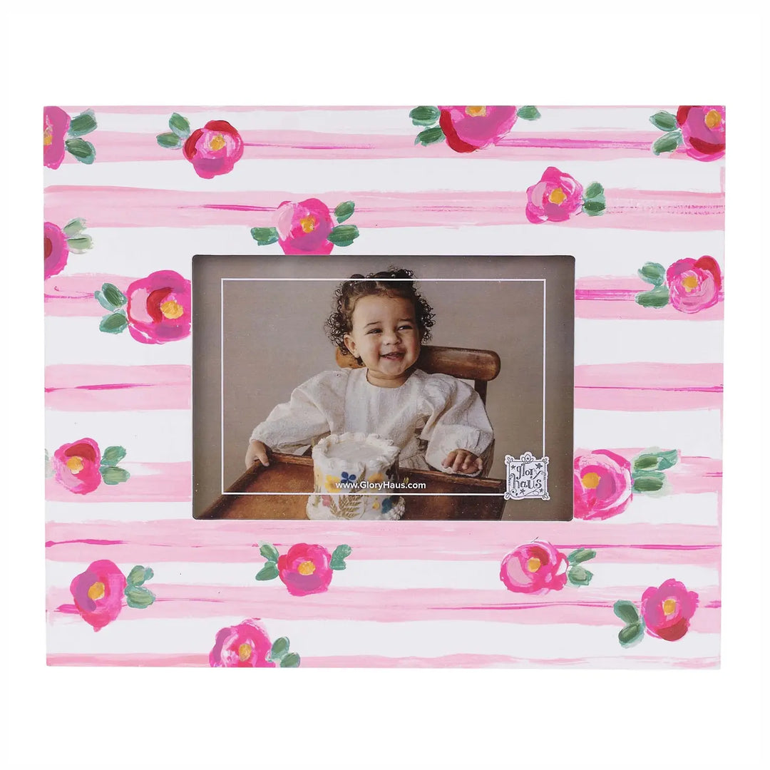 PINK STRIPE WITH FLORAL DETAIL PICTURE FRAME ON WHITE BACKGROUND
