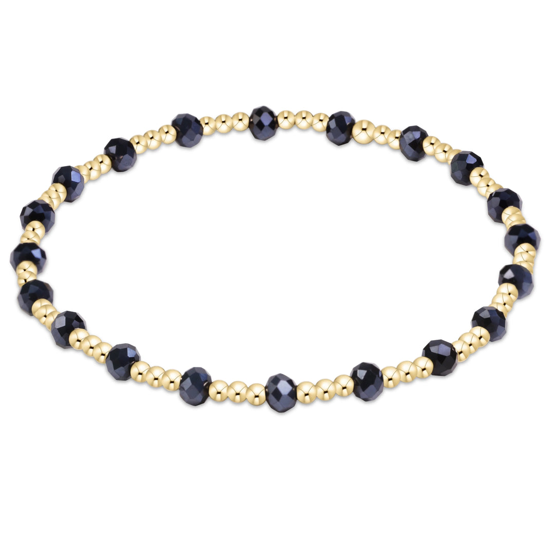 gold beaded bracelet with navy accents