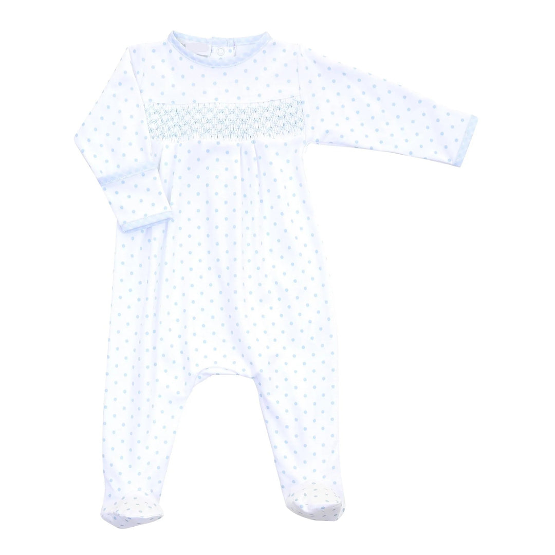White baby onesie with blue polka dots on a white background