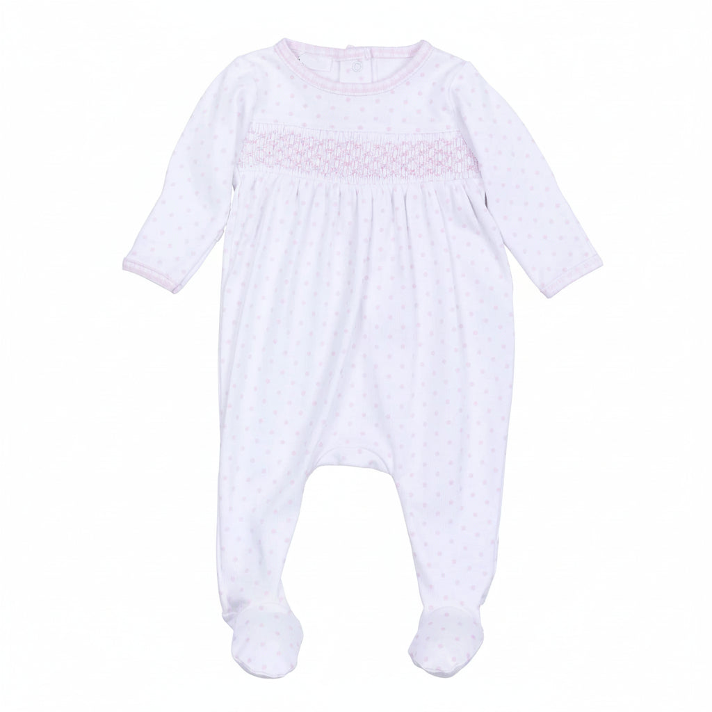 White baby onesie with pink smocking on a white background
