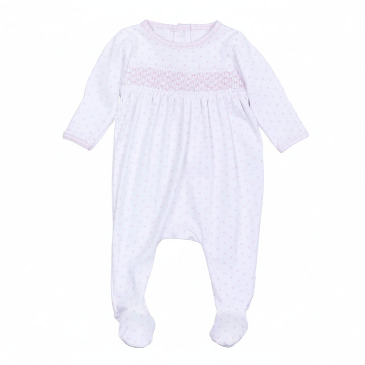 White baby onesie with pink smocking on a white background