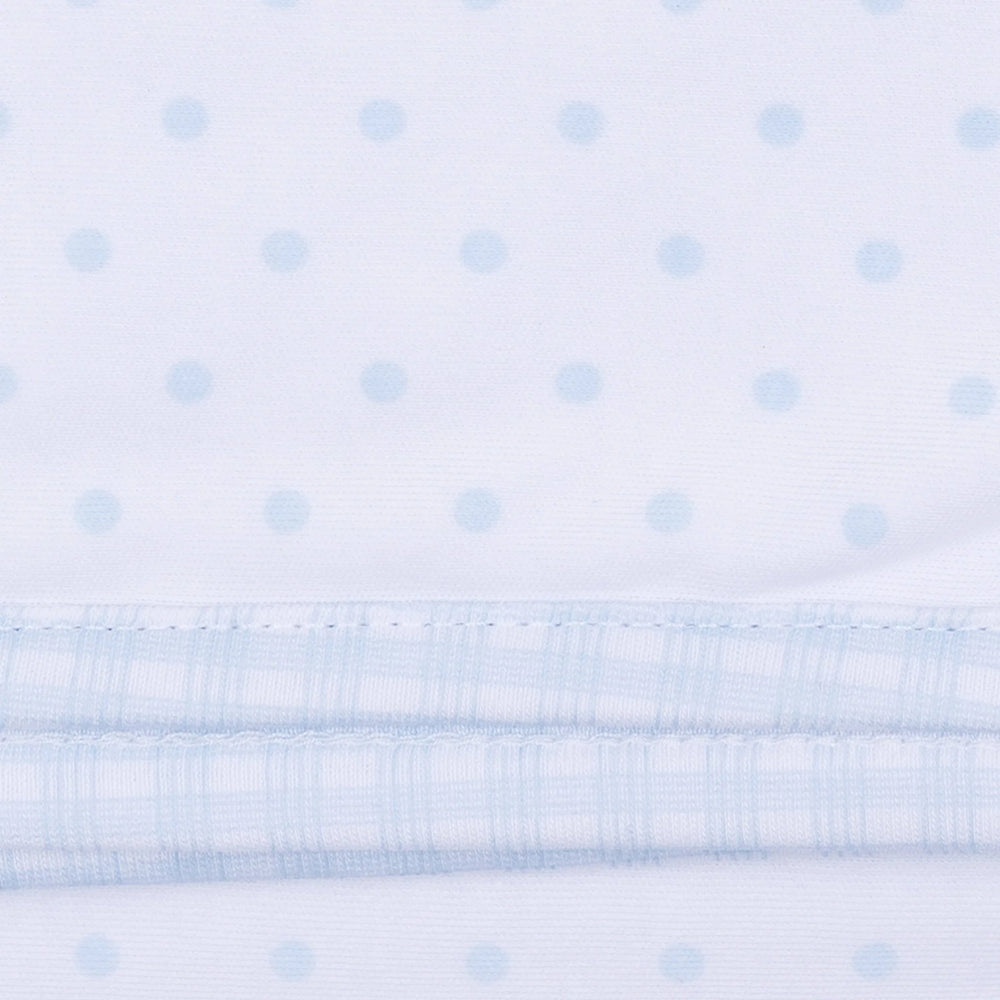 White fabric with a subtle light blue dot pattern and a gingham light blue trim.