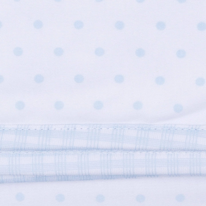White fabric with a subtle light blue dot pattern and a gingham light blue trim.