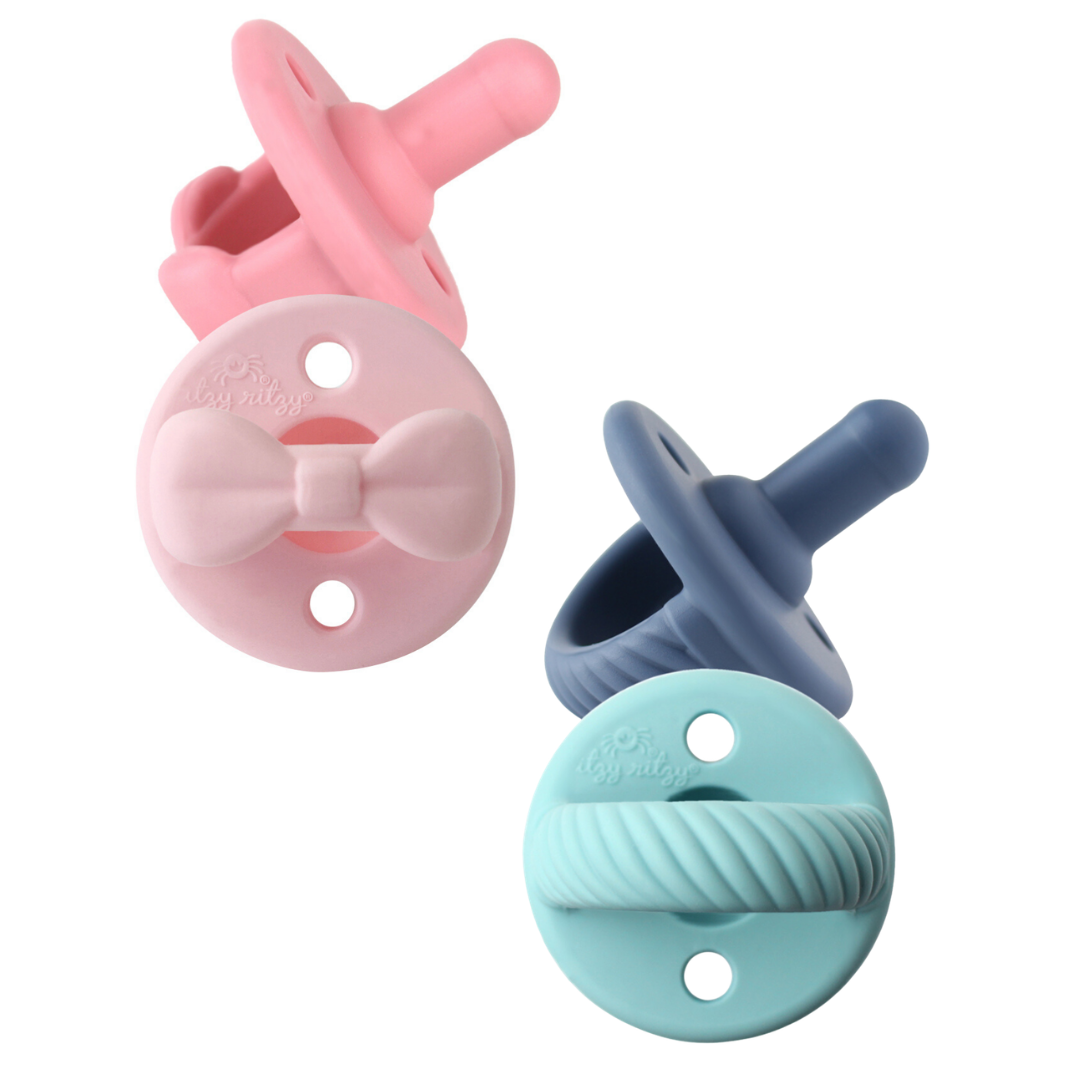 Pink and blue pacifier options in a set
