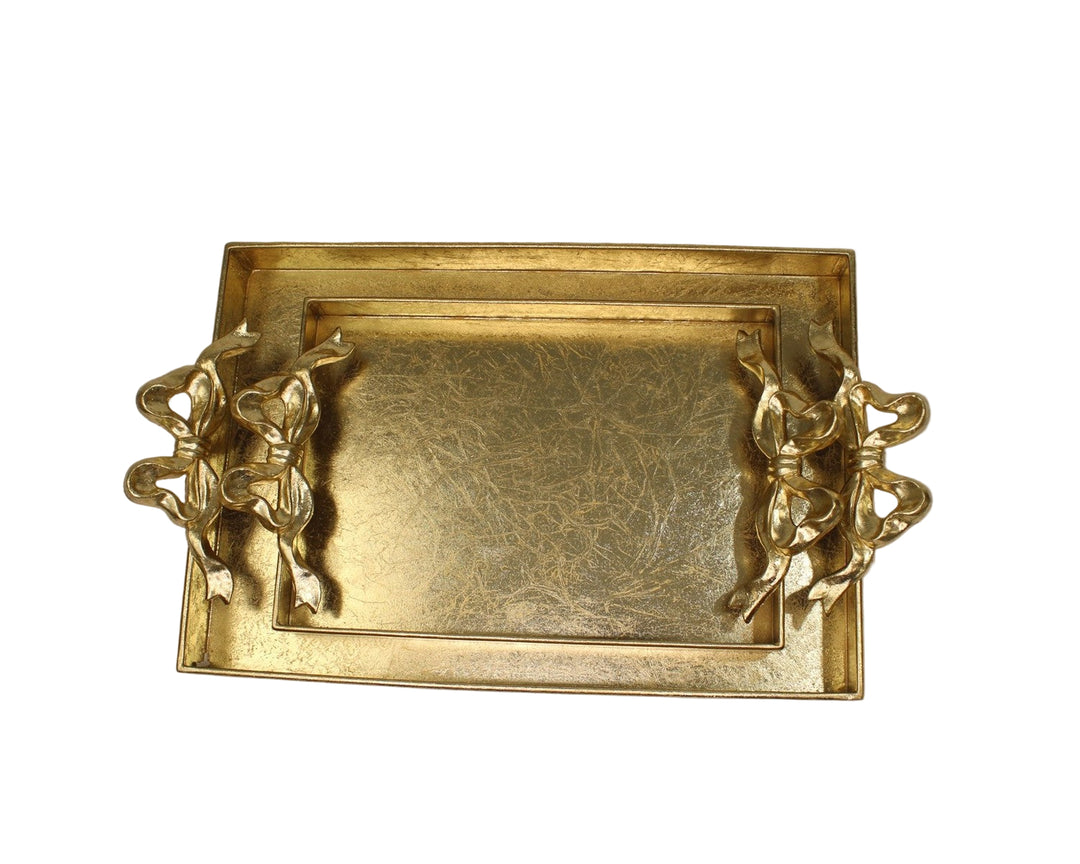 Gold decorative tray with cherub handles on a white background