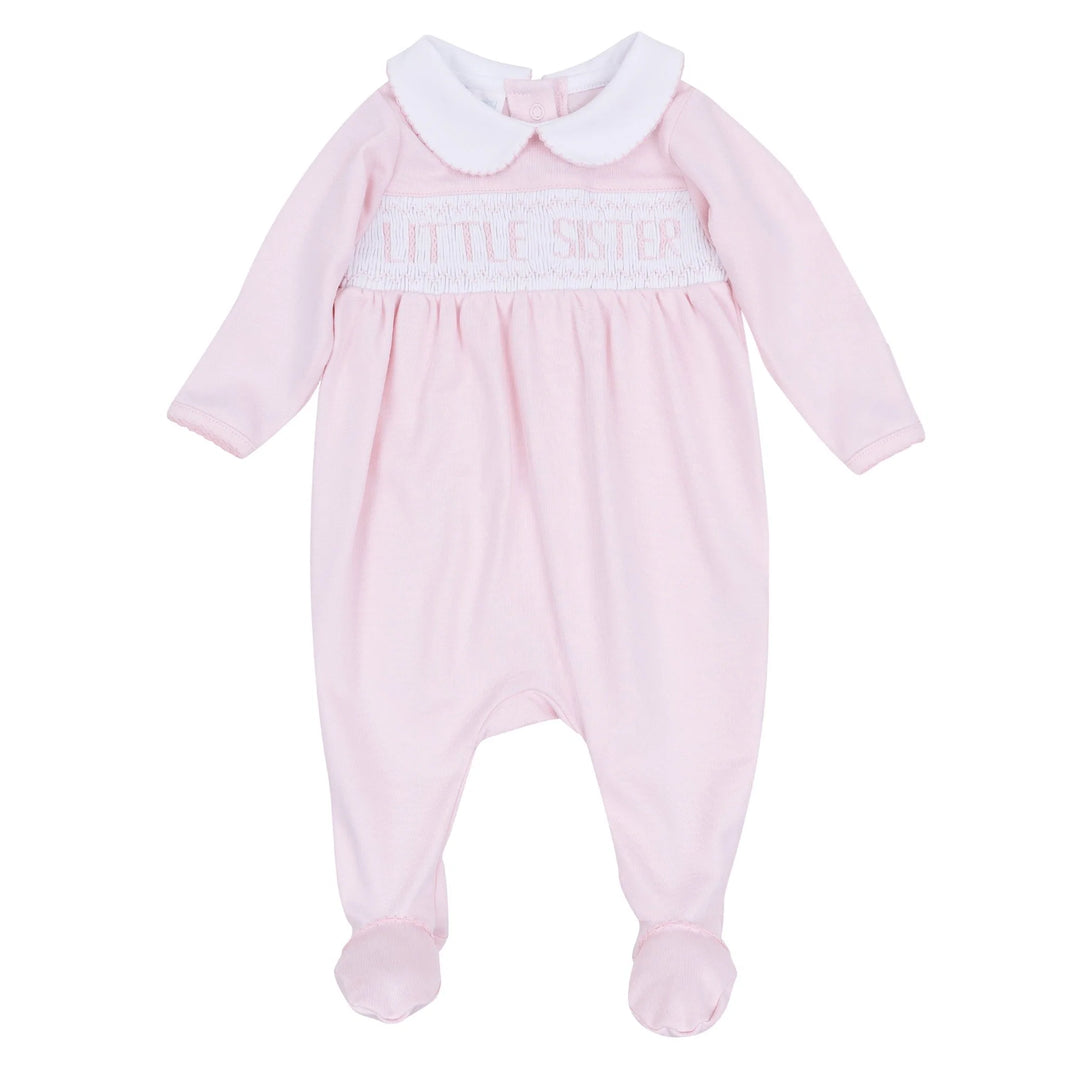 Pink baby onesie with white collar on a white background