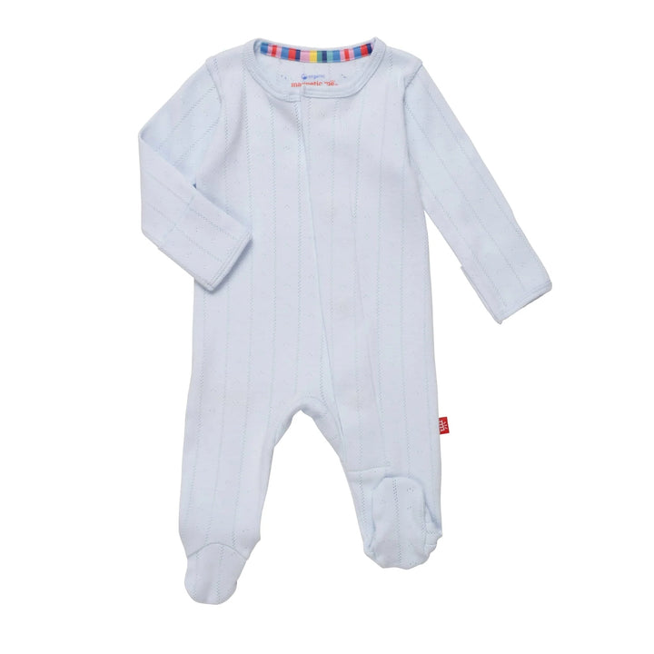 Light blue baby onesie with colorful trim on a white background