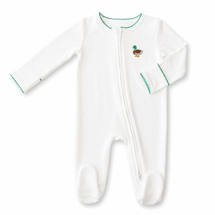 White baby footie with green trim and a small mallard motif on a white background