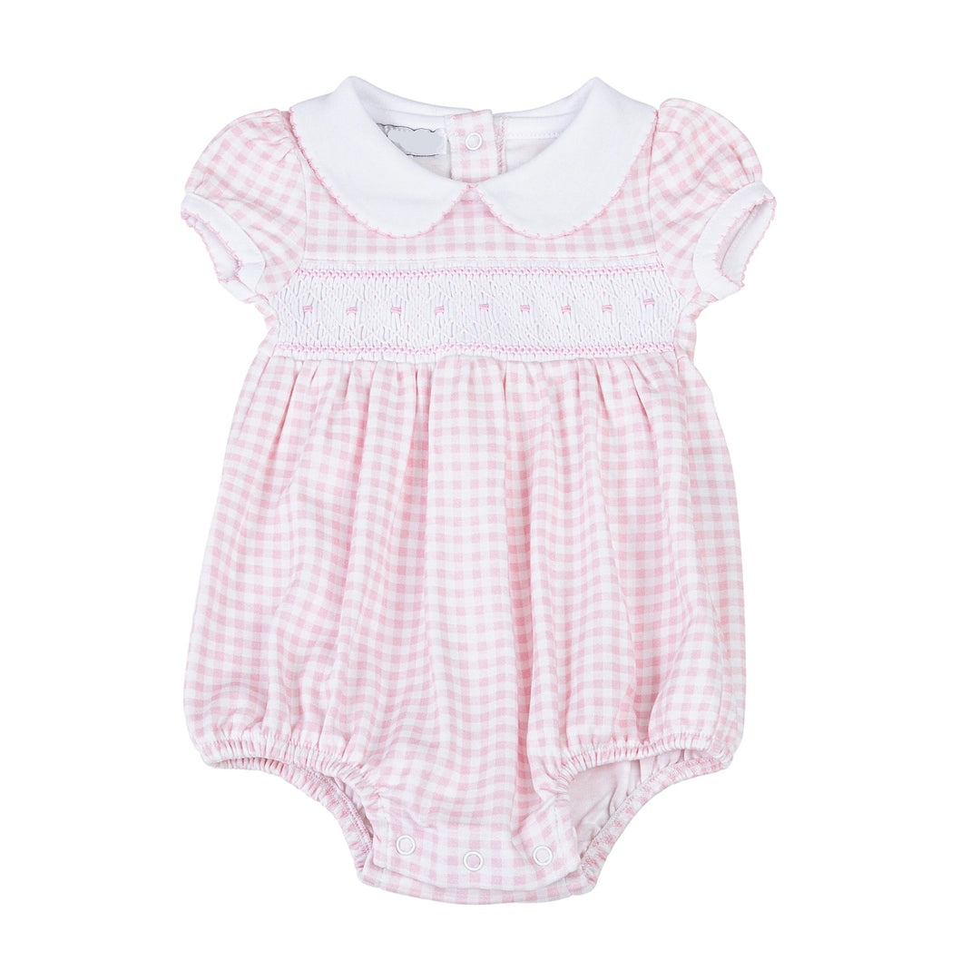 Pink gingham baby romper with white collar on a white background