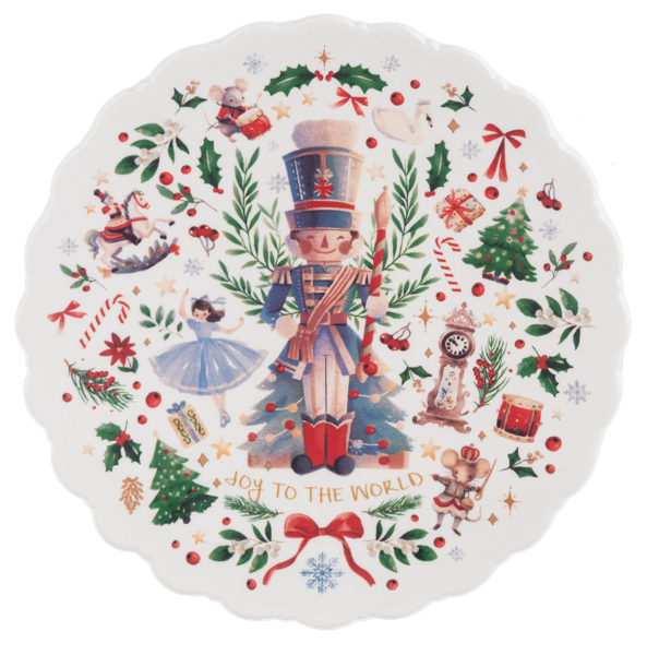 Decorative Christmas plate with a nutcracker design and 'Joy to the World' text.