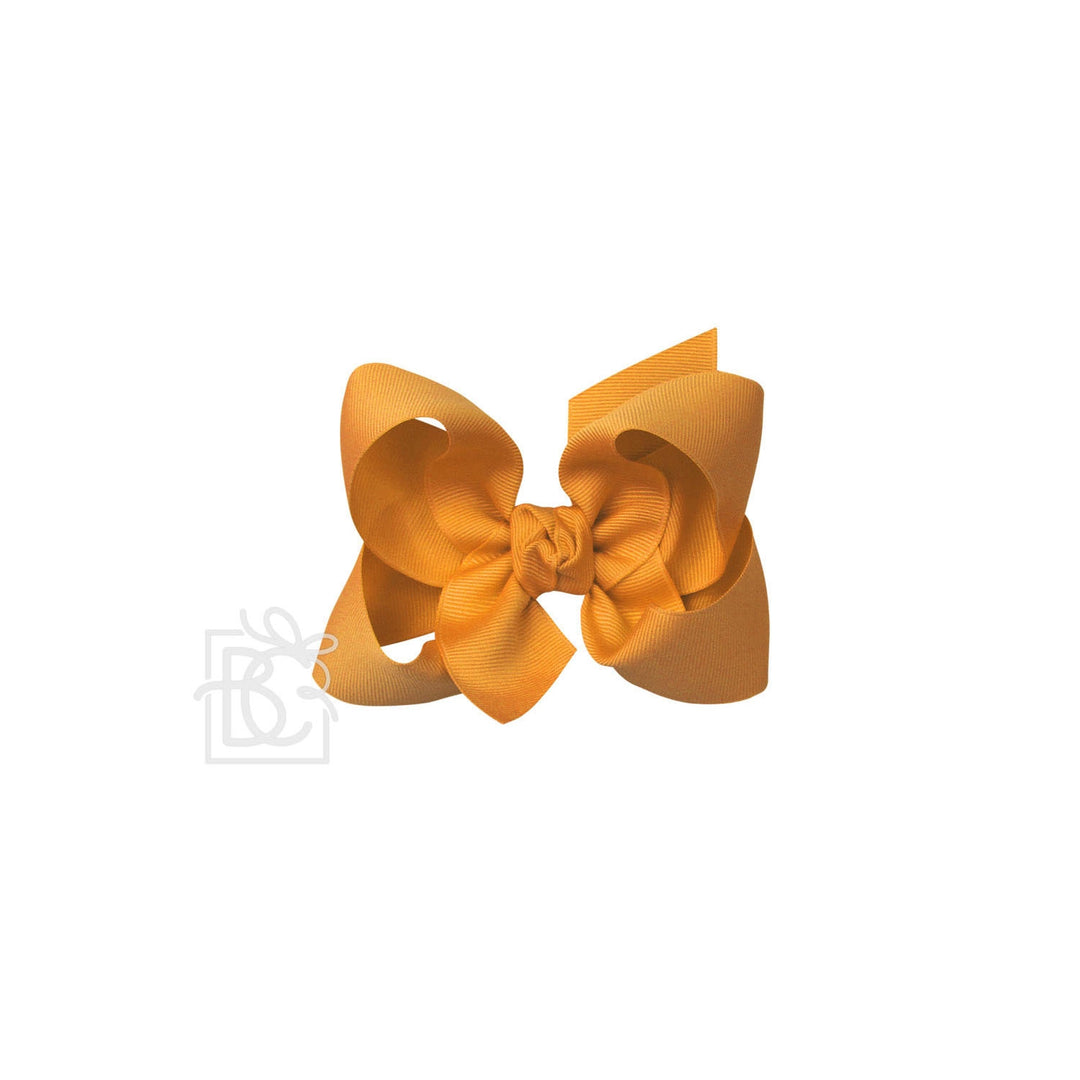 Yellow hair bow on a white background