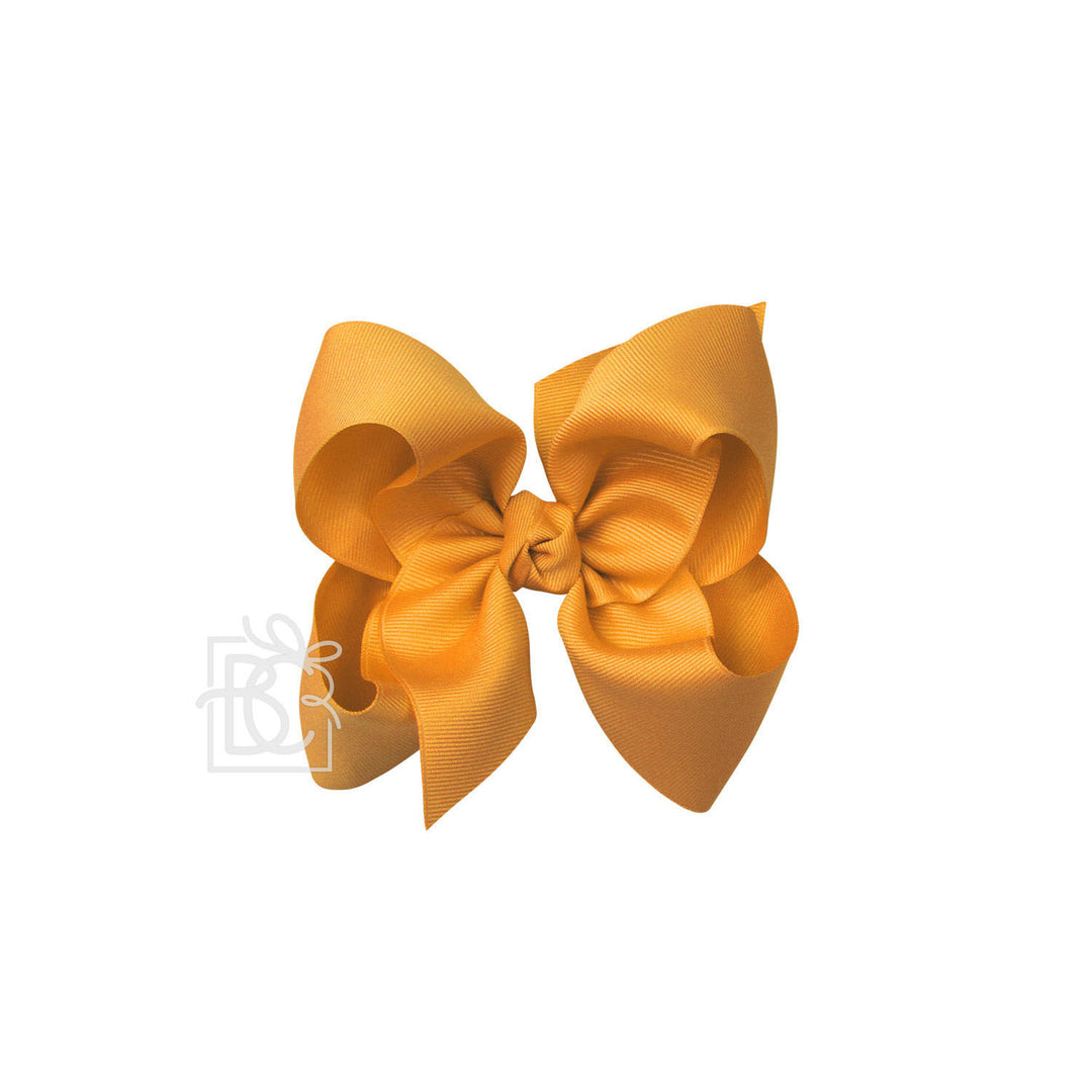 Yellow hair bow on a white background