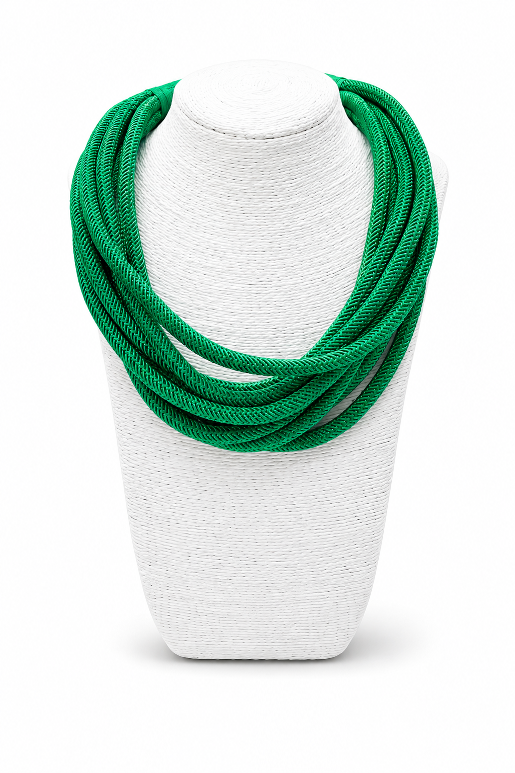 Kelly green layered braided statement necklace styled on a white display bust against a white background.