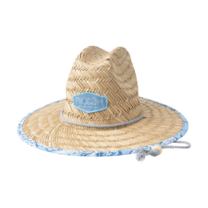 Straw hat with decorative elements on a plain background