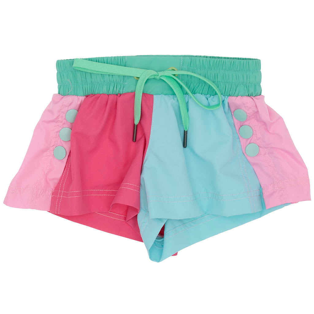 CHILDRENS COLOR BLOCK SHORTS WITH GREEN WAISTBAND AND PINK AND BLUE GEOMETRIC PATTERN