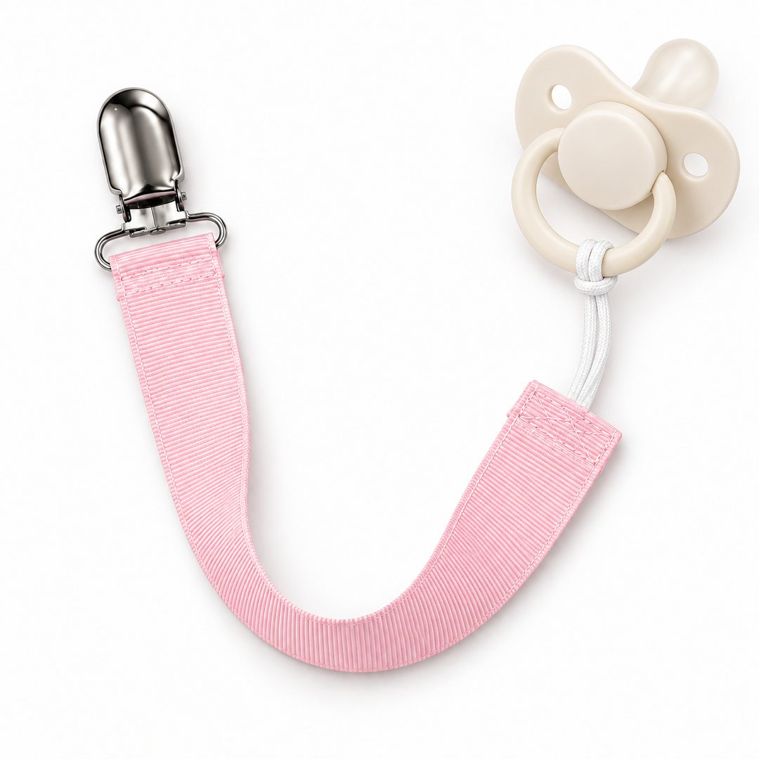 light pink paci clip showing how it holds a paci