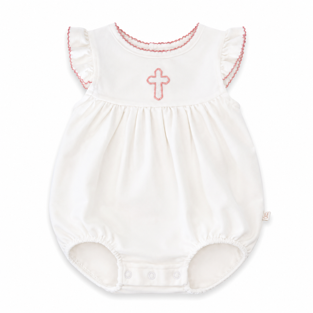 White baby romper with pink cross design on a white background